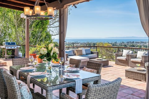 Upper patio offers stunning views, plush seating, and plenty of entertainment space to enjoy!