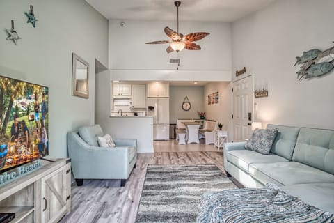 Comfortable living room with great natural light from ceiling skylight & balcony