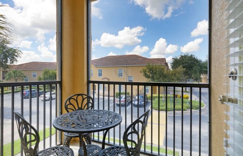 Unwind on the balcony, featuring a charming table for three