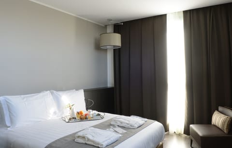 Premium bedding, down comforters, minibar, in-room safe