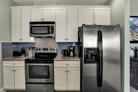The kitchen has all the appliances necessary and is upgraded wi/granite counters