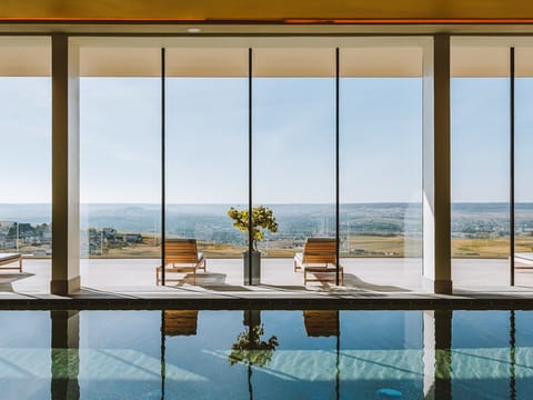Indoor pool, outdoor pool, open 8:00 AM to 8:00 PM, pool umbrellas