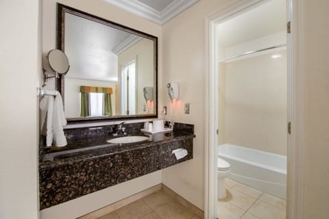 Desk, laptop workspace, blackout drapes, iron/ironing board