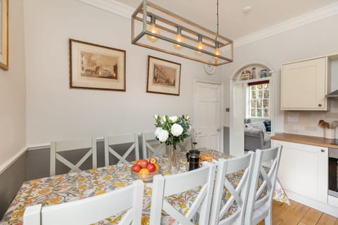 Light kitchen with seating for 10-12 and foldable table to seat upto 16 guests