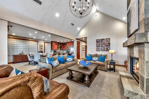 The great room combines comfy lounging, elegant dining, and state-of-the-art cooking all in one spacious room with gorgeous Lake Tahoe featured as the backdrop through the wall of windows