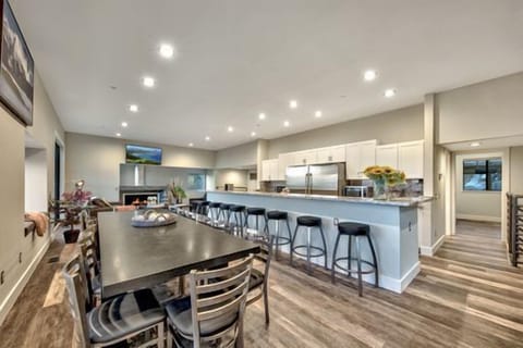 Experience the breath-taking views with the 20 foot high ceilings that capitalize on the breathtaking views of Genoa Valley and the Heavenly World class ski resort. 8 Large sectional sofas set in front of huge 60-inch Flat Screen TV, Additional seating in conversation area in the middle of the room for 12 in the Great room perfect for everyone to enjoy Food Drinks and the Family and Friends