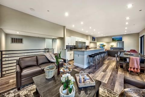 Experience the breath-taking views with the 20 foot high ceilings that capitalize on the breathtaking views of Genoa Valley and the Heavenly World class ski resort. 8 Large sectional sofas set in front of huge 60-inch Flat Screen TV, Additional seating in conversation area in the middle of the room for 12 in the Great room perfect for everyone to enjoy Food Drinks and the Family and Friends