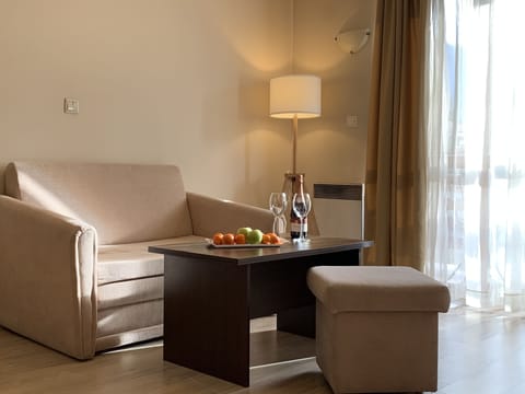 Apartment, 1 Bedroom, Balcony | Living area | TV