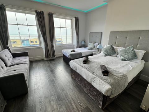 Gold Seaview Family of 3 + Sofa Bed | Individually decorated, individually furnished, iron/ironing board