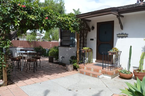 Lots of plants, flowers, succulents & cactus surround the patio with beauty