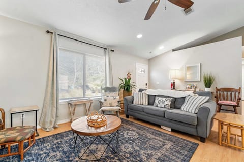 Relax and recharge in our bright, sun-filled living area. Whether you’re curling up on the plush sofa for a movie night or enjoying your morning coffee by the window, this coastal-inspired space is designed for ultimate comfort.