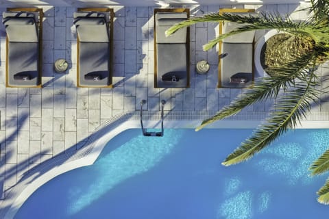 Outdoor pool, open 8 AM to 8 PM, pool umbrellas, sun loungers