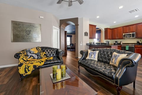 The main living room is dedicated to Hufflepuff with black & gold décor.