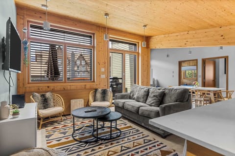Vacations are for relaxing, and this Scandi-inspired living room is the perfect place for some downtime as you plan your mountain adventures