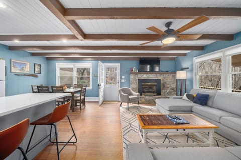 Smart TV above the remote controlled gas fireplace in the main floor living room