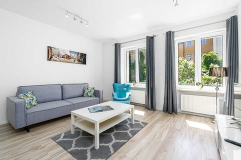 Living room with a comfortable sofa and TV. 