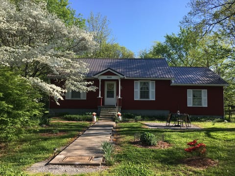 Front entrance in spring. A new metal roof was installed in October of 2018.