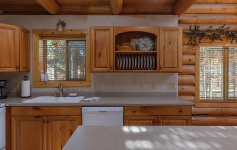 The kitchen features modern amenities including a microwave, oven, and coffee maker.