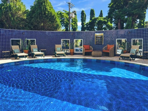 Outdoor pool, open 7:00 AM to 10:00 PM, pool umbrellas, sun loungers