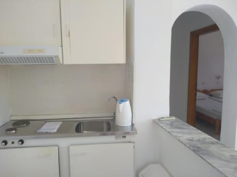 Mini-fridge, stovetop, electric kettle, cookware/dishes/utensils