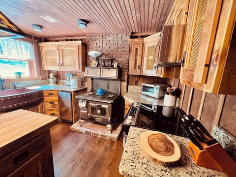 The kitchen was restored with the original wood-burning stove in place