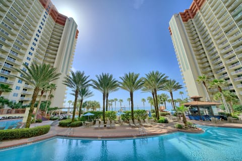 Cold drink in hand, tiki bar humming, grill firing, the Gulf sparkling just beyond the palms. This is Shores of Panama — and from your ground floor corner unit, you never have to go far to find it.