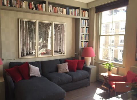Main room. South facing second floor looking over quiet street and birch trees