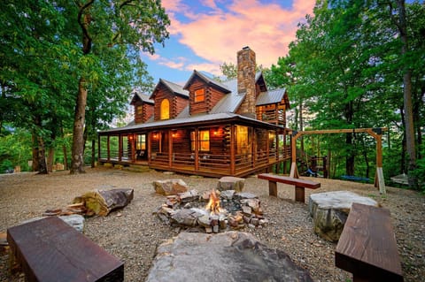 Cabin has 3 levels including 2 living areas gameroom/playground/swingset/hot tub