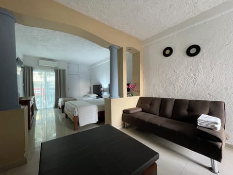 Standard Suite, Multiple Beds, Non Smoking, Balcony | Living area | 32-inch Smart TV with digital channels
