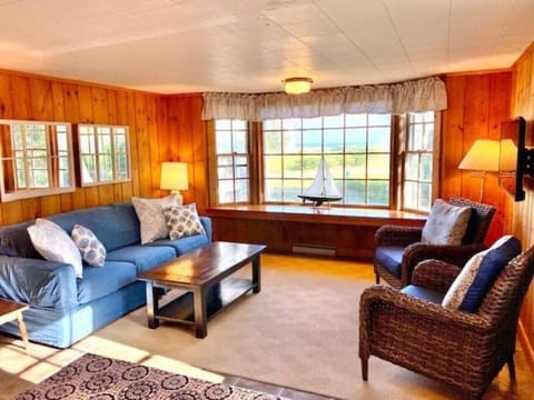 Dune Suite living room with large bay window with ocean view.