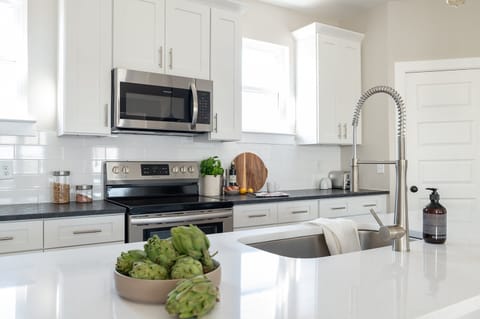 Kitchen is well-equipped and features modern appliances.