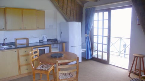 D Cottage | Private kitchen | Full-size fridge, microwave, oven, stovetop