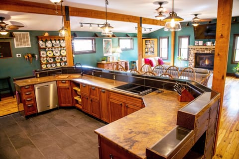 Great room with kitchen, dining room & living room connects to the kids' room.