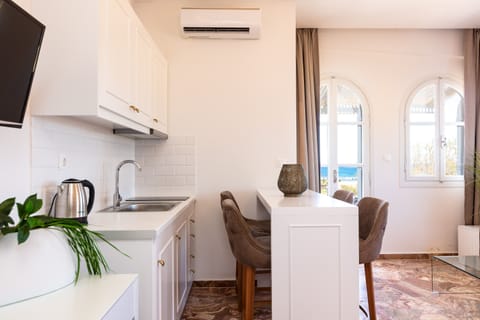 Junior Suite, Sea View | Private kitchen | Mini-fridge, electric kettle, cookware/dishes/utensils, dining tables