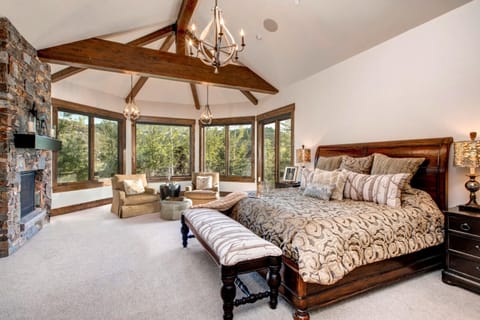 Wake up to mountain views from your spacious primary suite with vaulted ceilings, King bed, and warm alpine finishes.