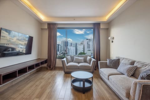 Deluxe Studio | Living area | 42-inch flat-screen TV with cable channels, TV