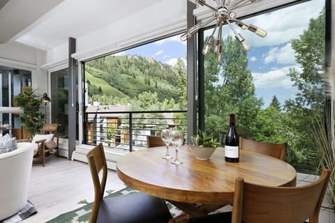 The floor to ceiling windows bring the outdoors in, a great place to enjoy a glass of wine before a night out in Aspen.