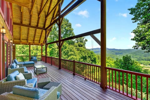Enjoy morning coffee or an evening glass of wine on the fantastic covered deck overlooking majestic mountain views at Shadow Ridge Retreat!