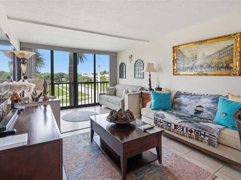 Living room and enclosed balcony with view
