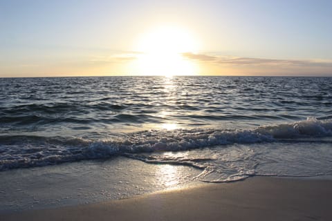 Beach nearby, white sand, beach umbrellas, beach towels