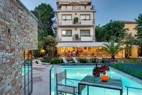 Outdoor pool, a lap pool, open 8:00 AM to 7:30 PM, sun loungers