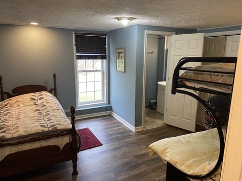 Bedroom 2, 2nd floor.  Bunk beds and twin.