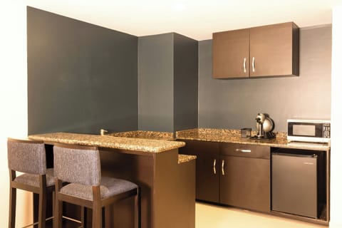 Suite, 1 King Bed | Private kitchen | Fridge, microwave, coffee/tea maker