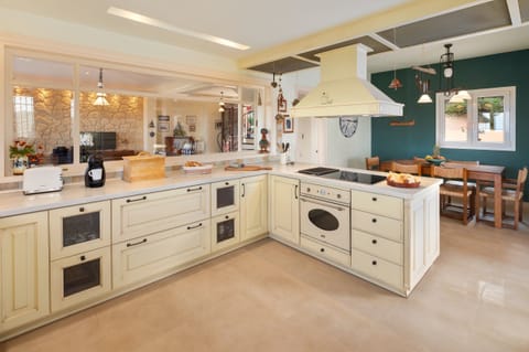 The fully equipped kitchen has an elegant yet functional design
