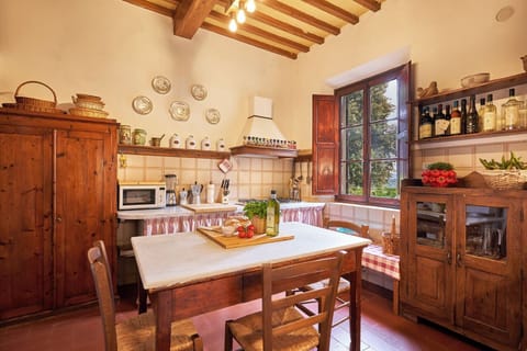 Traditional Tuscan kitchen with antique wood cabinetry