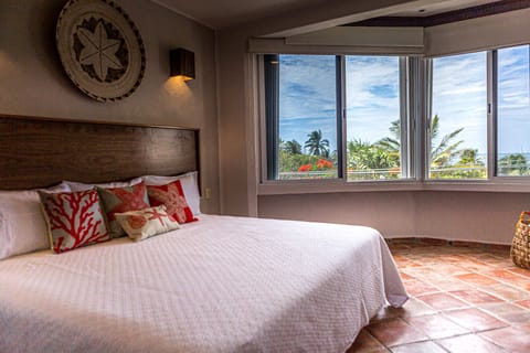 Master bedroom with king size bed and private full bathroom