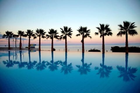 Seasonal outdoor pool, open 10:30 AM to 6:30 PM, pool umbrellas