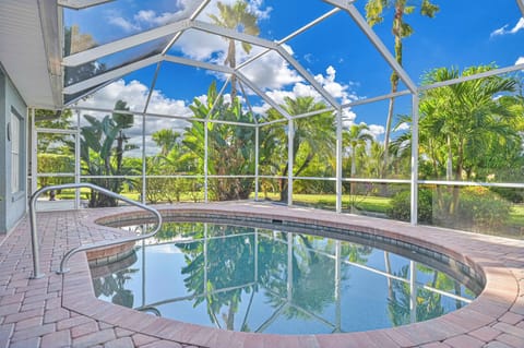 Blue Bay new - The private, heated pool is surrounded by lush landscaping