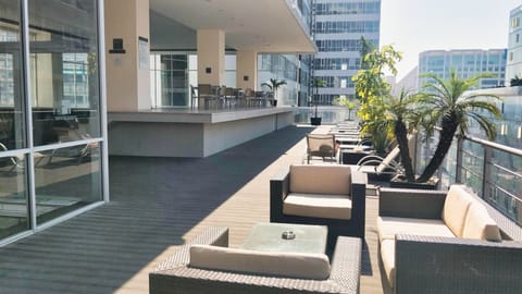 Upper level sun deck, open pool and bar area