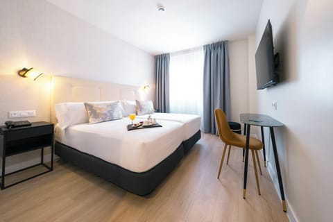 Deluxe Room | In-room safe, desk, blackout drapes, iron/ironing board